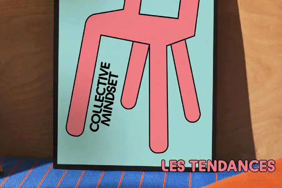 Affiche rose et turquoise Collective mindset posée sur un tapis rayé — les tendances du coliving en France, blog IvyNest